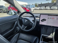 This Tesla Model 3 delivers a Electric engine powering this Automatic transmission. Window Grid Ante... (image 8)