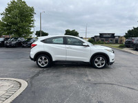 Unwind in this sleek 2018 Honda HR-V LX, boasting a pristine White Orchid Pearl exterior. With only... (image 3)