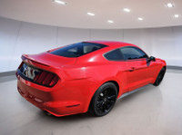 Experience the thrill of the open road in this stunning red Mustang, where power meets elegance. The... (image 2)