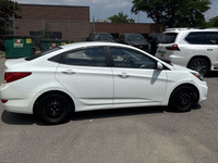 This 2014 Hyundai Accent Sedan is a reliable and stylish choice! With its sleek white exterior and c... (image 3)
