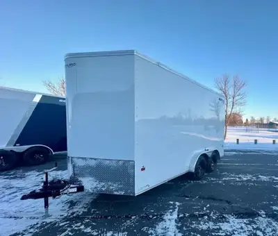 7.5x16 v-nose cargo trailer. 86 inch interior wall height. Ramp door. Comes with spare tire. White i...