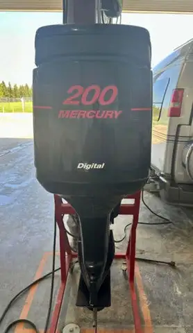 2002 Mercury Optimax. 200HP, Long shaft (20 inch). This motor had numerous items replaced or rebuilt...