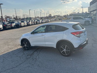 Elevate your driving experience with the striking White Honda HR-V Sport, featuring an All-Wheel Dri... (image 2)