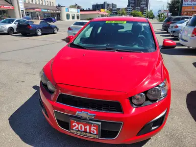 2015 CHEVROLET SONIC HATCHBACK ..BRIGHT RED BEAUTY WITH ONLY 148000KMS! ONE LADY OWNER!!! BRAND NEW...