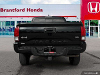 Conquer any terrain with this 2020 Toyota Tacoma Crew Cab Pickup, boasting a rugged Magnetic Grey Me... (image 4)