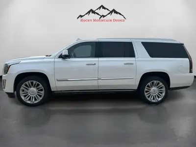 The 2016 Cadillac Escalade ESV Platinum in White combines robust 4×4 capabilities with luxurious dri...