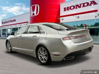 Experience effortless elegance with this 2016 Lincoln MKZ. Boasting a sleek silver exterior and a me... (image 3)