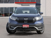 WAS: $26250 NOW: $25250 plus taxes and licensing feesThe 2021 Honda CR-V Touring in a stunning Blue... (image 1)