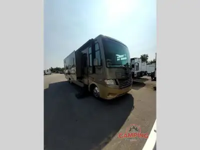 The Bay Star 3308 motor home by Newmar offers triple slides, which adds so much more room to the mot...