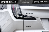 The Cadillac XT4 AWD Sport in a striking white exterior combines sleek elegance with the confidence... (image 6)