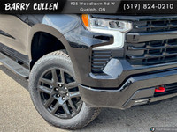 Experience the 2025 Chevrolet Silverado 1500 LT Trail Boss, an impressive black 4x4 truck designed t... (image 1)