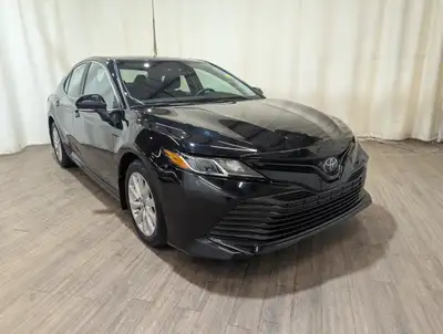 Locally Owned Vehicle! The 2019 Toyota Camry LE in sleek black with front-wheel drive delivers a bal...