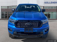 This 2021 Ford Ranger 4x4 Crew Cab, Velocity Blue with a sleek black interior, is ready for adventur... (image 7)