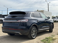 Under the glistening Rhapsody Blue exterior, the 2019 Lincoln Nautilus Reserve stands as a testament... (image 7)
