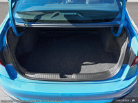 The 2025 Volkswagen Jetta Comfortline is a stunning blue sedan that offers a smooth driving experien... (image 6)
