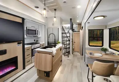 This destination trailer is perfect for the whole family. 2 bathrooms, 2 bedrooms, and 2 upper lofts...