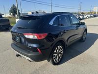 The 2021 Ford Escape Titanium AWD is a sleek and sporty compact SUV that balances style, comfort, an... (image 4)