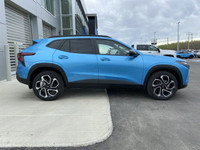 Zipping through the streets of Calgary, the 2025 Chevrolet Trax in Summit White is a sight to behold... (image 9)