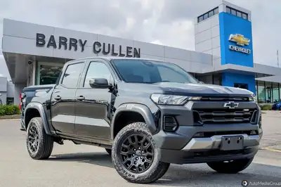 Get ready to conquer the road with the 2023 Chevrolet Colorado 4WD Trail Boss. This commanding black...
