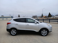 Drive with confidence in this 2011 Hyundai Tucson! With its spacious interior, smooth handling, and... (image 3)
