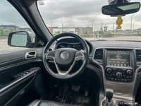 This Grand Cherokee features leather-trimmed, ventilated front seats, heated front and rear seats, p... (image 9)