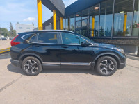 Summary The Touring represents the pinnacle of the 2019 CR-V lineup, offering a refined blend of per... (image 7)