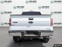 The 2014 Ford F-150 in pristine white is a robust 4x4 truck designed for those who demand power and... (image 5)