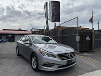 This 2016 Hyundai Sonata is a reliable sedan with a sleek gray exterior and a spacious interior in a... (image 6)