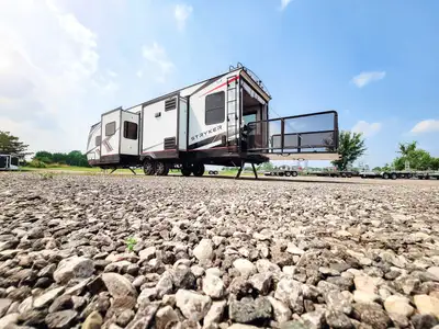 STRYKER ST3414 TOY HAULER WITH UPGRADED REAR PATIO WITH FOLDING RAILS, AND 50 AMP SERVICE WITH 2ND A...
