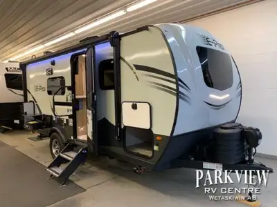 Queen island bed! Large bathroom! Easy to tow off grid travel trailer! Options: -2x6volt batteries,...
