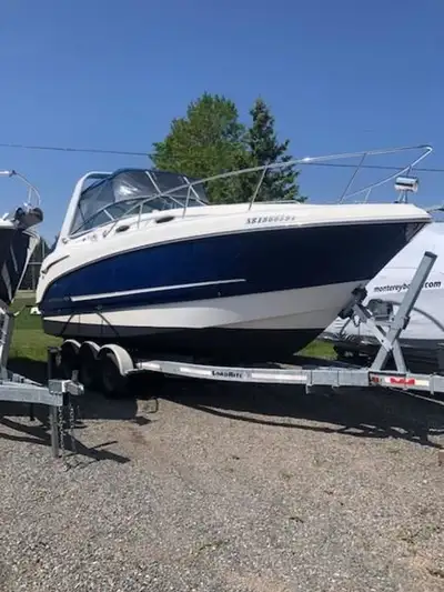 INCLUDES: tri axle galvanized trailer, full enclosure, Twin Mercruiser 4.3 MPI, seadek flooring in c...