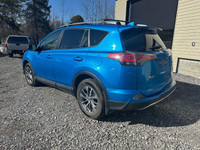 The 2017 Toyota RAV4 Hybrid XLE in a stunning blue finish offers exceptional control with its AWD dr... (image 2)