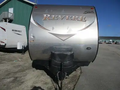 This two slide, two bedroom family trailer has an outside kitchen , side bath w/ skylight over the t...