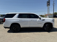 Roll out in style with this elegant and robust 2023 GMC Yukon SLT, showcasing a luxurious White Fros... (image 9)