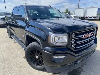 Poised for performance and utility, the 2018 GMC Sierra 1500 SLT stands proudly with a sleek Onyx Bl...