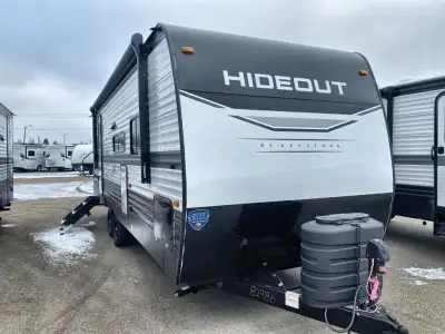 Keystone Hideout DLX travel trailer 24RBSWE highlights: Full Rear Bath Sofa Laundry Chute Pantry Pas...