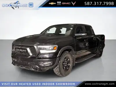 Get behind the wheel of our fierce used 2020 RAM 1500 Rebel Crew Cab short box 4X4 in Diamond Black...