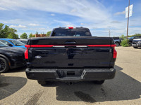 This brand new ANTIMATTER BLUE METALLIC 2025 FORD F-150 LIGHTNING LARIAT is powered by an ELECTRIC E... (image 8)