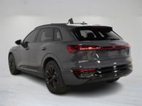 This 2024 Audi Q8 e-tron blends all-electric power with refined luxury, finished in a sleek dark gre... (image 3)