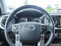 From work to weekends, this previous daily rental Black 2023 Toyota Tacoma muscles through any terra... (image 9)