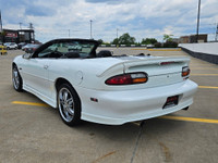 Unleash raw American muscle this summer with this stunning 2002 Chevrolet Camaro Z28 Convertible. Po... (image 5)