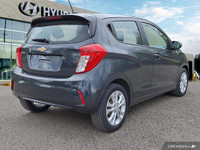 This 2021 Chevrolet Spark 1LT Hatchback offers surprising practicality in a compact package. Its pep... (image 4)