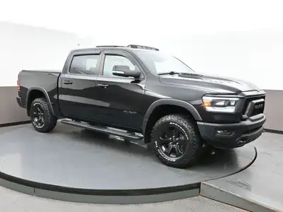 The 2021 Ram 1500 Rebel is a bold, off-road-focused full-size truck with a 5.7L HEMI V8 producing 39...