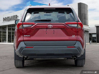 This 2020 Toyota RAV4 LE boasts a stunning Ruby Flare Pearl exterior and a sleek black interior. Its... (image 4)