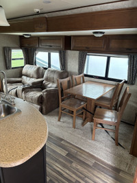 This opposing slides trailer is sure to impress anybody that walks through the door! This rear livin... (image 2)