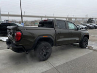 The 2024 GMC Canyon Elevation in Deep Bronze Metallic is a rugged and capable mid-size truck. Its bo... (image 7)