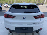Unveil the allure of the 2022 BMW X2 xDrive28i, a summit of automotive craftsmanship adorned in a st... (image 7)