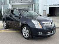 The 2015 Cadillac SRX Premium Collection, shown in Sapphire Blue Metallic, delivers confident perfor... (image 9)