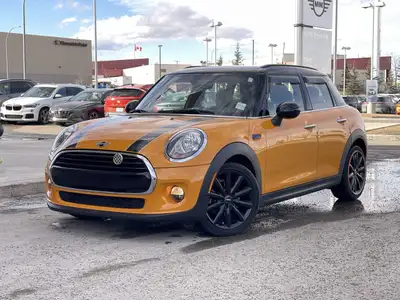 This 2018 Mini Cooper 5 door finished in volcanic orange is not only unique but filled with all the...