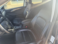 The 2021 Ford Escape Titanium AWD is a sleek and sporty compact SUV that balances style, comfort, an... (image 9)